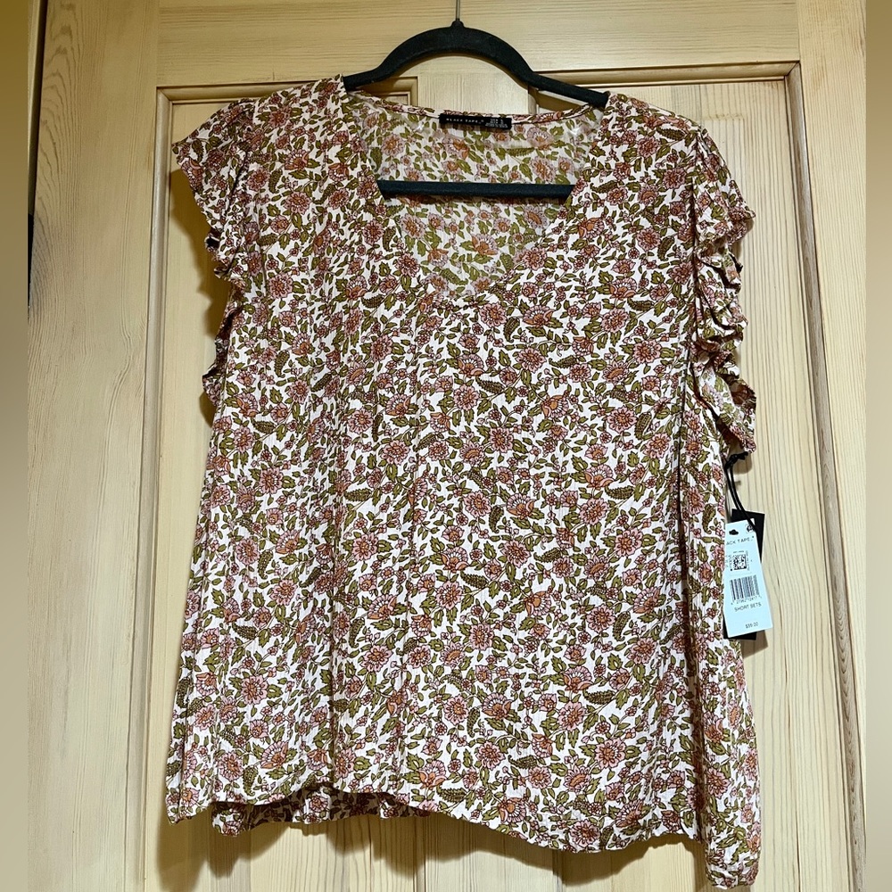 Women’s top size L. New with tags.